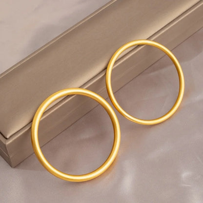 Brazalete abierto de acero inoxidable pulido chapado en oro