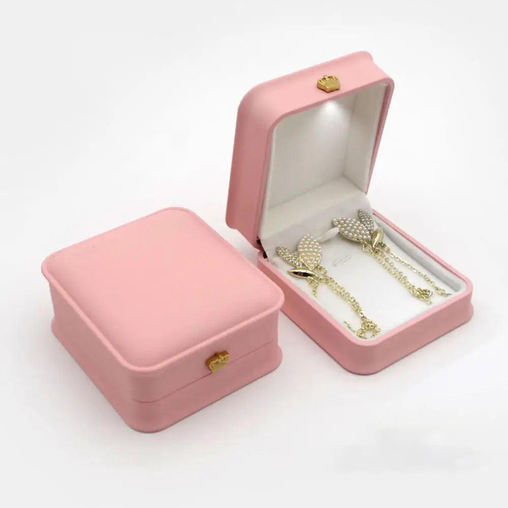 Caja de joyería con luz LED para anillos, collares y regalos